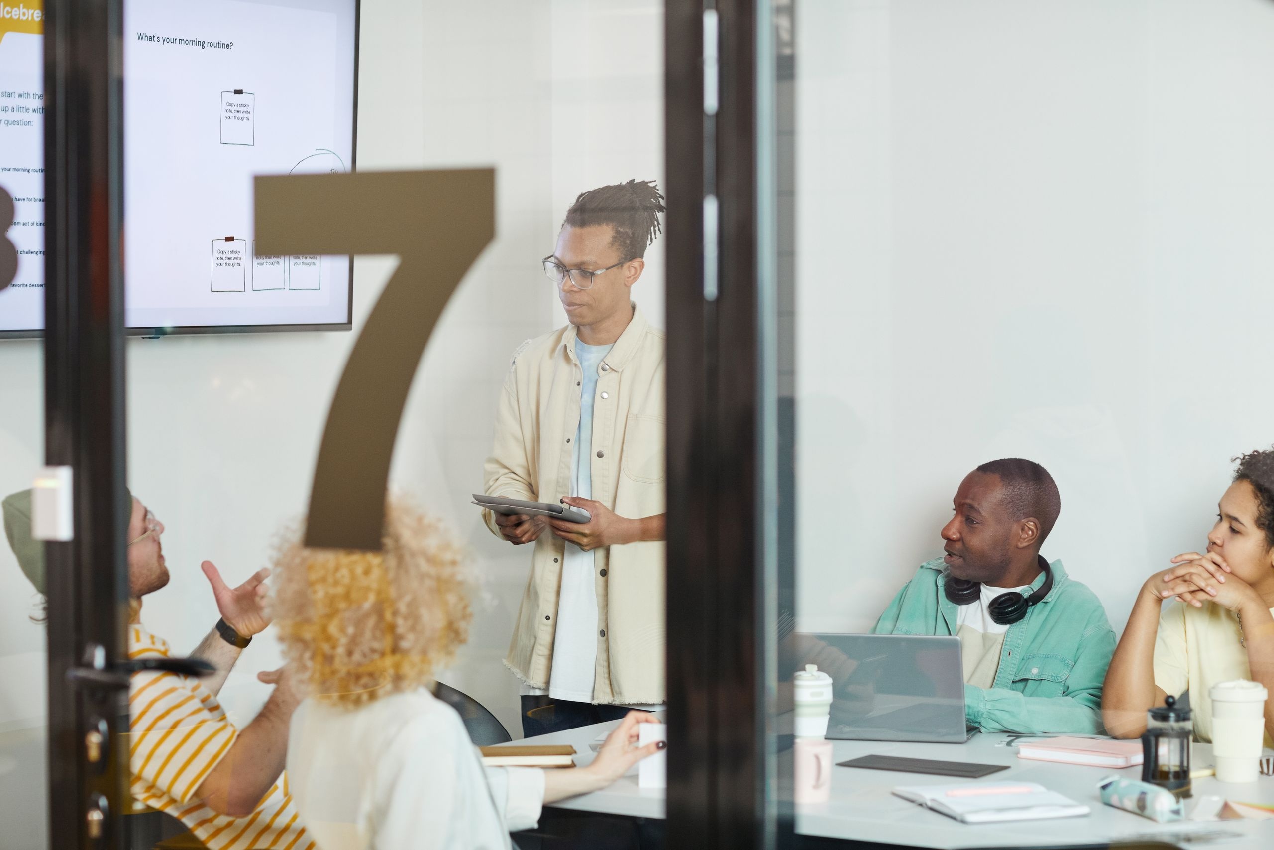 A Team Having a Meeting Inside the Conference Room